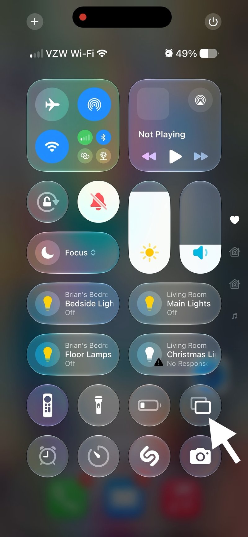 Pull down from the top right of your device to access the Control Center. Tap the overlapping rectangles to open the Screen Sharing menu.